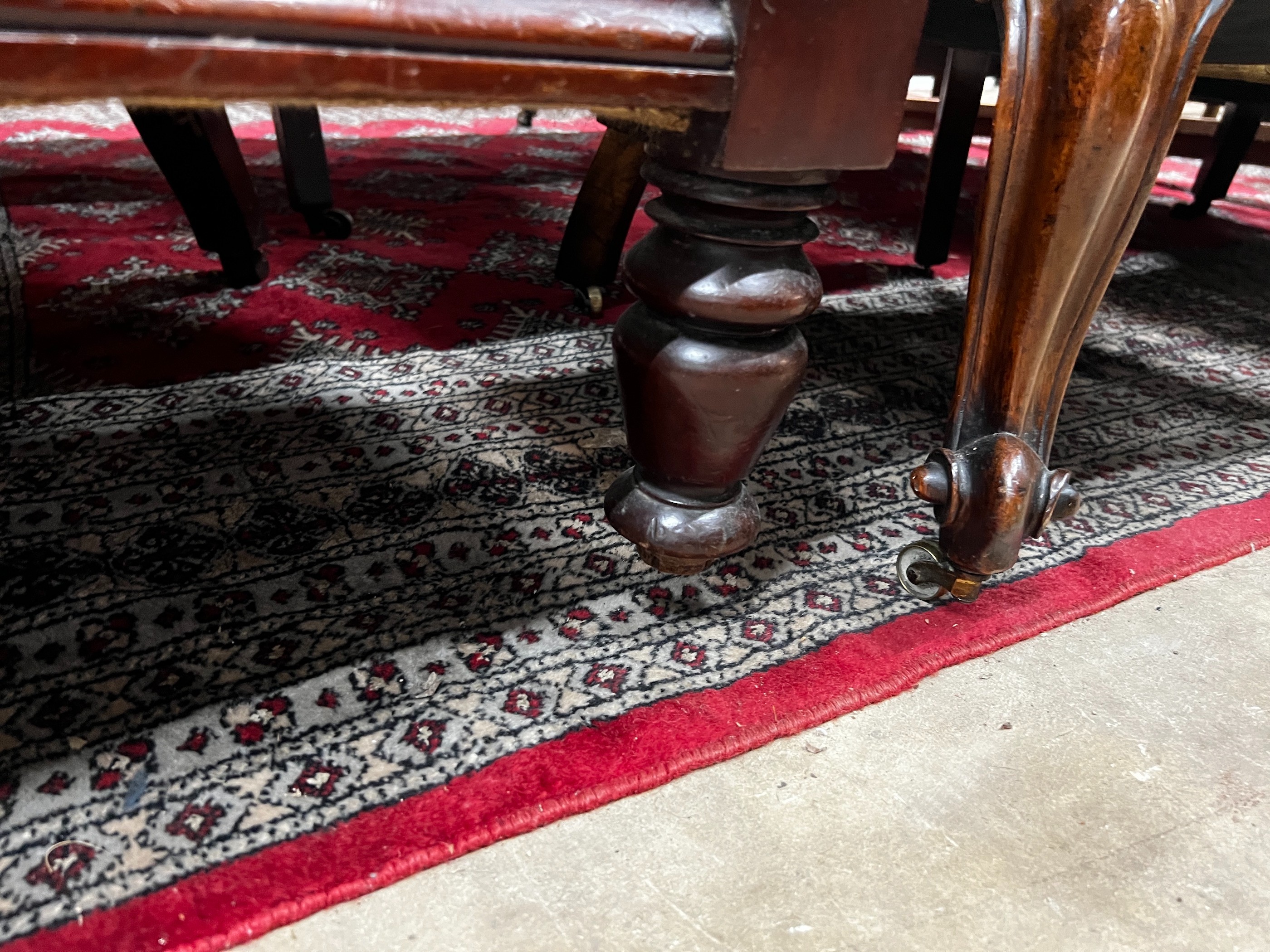 A Victorian mahogany armchair upholstered in deep buttoned brown leather, width 68cm, depth 80cm, height 96cm